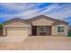 Charming single-story home featuring a two-car garage, low-maintenance landscaping, and a welcoming front porch at 34834 N Surrey Ln, San Tan Valley, AZ 85140