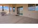 Covered patio with outdoor seating, perfect for relaxing and entertaining, featuring a neutral color palette at 34834 N Surrey Ln, San Tan Valley, AZ 85140
