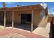 A covered patio area extends to a brick portion, perfect for outdoor seating and enjoying the backyard at 3779 E Sweetwater Ave, Phoenix, AZ 85032