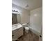 Bathroom featuring an updated vanity, mirror, and toilet, and a shower-tub combo with tiled walls at 3779 E Sweetwater Ave, Phoenix, AZ 85032