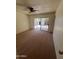 This bedroom features neutral walls, carpet flooring, and a sliding glass door to the backyard at 3779 E Sweetwater Ave, Phoenix, AZ 85032