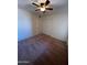 This bedroom features carpet flooring, a ceiling fan, and a double door closet for optimal storage at 3779 E Sweetwater Ave, Phoenix, AZ 85032