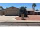 Charming single-story home with a two car garage and desert landscaping on a sunny day at 3779 E Sweetwater Ave, Phoenix, AZ 85032