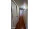 Hallway with wood floors and neutral paint at 3779 E Sweetwater Ave, Phoenix, AZ 85032