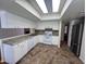 Bright kitchen featuring white cabinets, stainless steel appliances, and neutral countertops at 3779 E Sweetwater Ave, Phoenix, AZ 85032