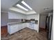 Eat-in kitchen features white cabinets, tile backsplash and ample counter space at 3779 E Sweetwater Ave, Phoenix, AZ 85032