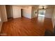 Open concept living room with wood floors, neutral walls and lots of natural light at 3779 E Sweetwater Ave, Phoenix, AZ 85032