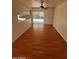 Bright living room features wood floors and sliding glass doors to the backyard at 3779 E Sweetwater Ave, Phoenix, AZ 85032