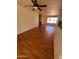 Inviting living room with wood floors, a cozy brick fireplace and an open concept design at 3779 E Sweetwater Ave, Phoenix, AZ 85032