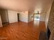 Spacious living room with wood floors and a brick fireplace, perfect for entertaining at 3779 E Sweetwater Ave, Phoenix, AZ 85032