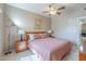 This bedroom features a comfortable bed, and windows with views of the outside, creating a cozy and inviting room at 3830 E Lakewood Pkwy # 1051, Phoenix, AZ 85048