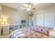 Charming bedroom featuring two twin beds, built in desk and ceiling fan at 3830 E Lakewood Pkwy # 1051, Phoenix, AZ 85048