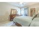 Primary bedroom featuring a queen bed, large dresser, and outdoor access at 3830 E Lakewood Pkwy # 1051, Phoenix, AZ 85048