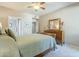 Spacious bedroom featuring a queen bed, large dresser and access to the ensuite bathroom at 3830 E Lakewood Pkwy # 1051, Phoenix, AZ 85048
