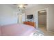 Spacious bedroom with a ceiling fan, dresser, a walk-in closet providing ample storage space at 3830 E Lakewood Pkwy # 1051, Phoenix, AZ 85048