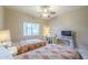 Inviting bedroom features twin beds, desk and bright window at 3830 E Lakewood Pkwy # 1051, Phoenix, AZ 85048