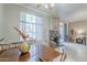 The dining room features a large window, fireplace and access to the outdoor area creating a cozy atmosphere at 3830 E Lakewood Pkwy # 1051, Phoenix, AZ 85048