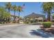 Community entrance features mature landscaping, monument sign, and American flag at 3830 E Lakewood Pkwy # 1051, Phoenix, AZ 85048