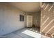 Charming condo entryway featuring a decorative screen door and neutral stucco exterior for easy maintenance at 3830 E Lakewood Pkwy # 1051, Phoenix, AZ 85048