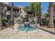 Inviting hot tub area surrounded by lush landscaping, offering a tranquil and relaxing retreat at 3830 E Lakewood Pkwy # 1051, Phoenix, AZ 85048
