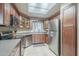 Well-designed kitchen featuring stainless steel appliances, ample cabinetry, and a sunlit tile floor at 3830 E Lakewood Pkwy # 1051, Phoenix, AZ 85048
