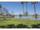 Inviting lakeside community view offers a peaceful retreat with lush green lawns at 3830 E Lakewood Pkwy # 1051, Phoenix, AZ 85048