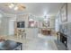 Spacious living room with tile floors, fireplace, and seamless flow to dining and kitchen areas at 3830 E Lakewood Pkwy # 1051, Phoenix, AZ 85048