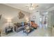 Comfortable living room features neutral tones, tile flooring, and a ceiling fan for a relaxing atmosphere at 3830 E Lakewood Pkwy # 1051, Phoenix, AZ 85048