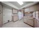 Traditional kitchen features neutral cabinets, tiled floors, and a white refrigerator at 3833 W Rene Dr, Chandler, AZ 85226