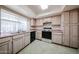 The open kitchen is well lit and features tile floors and ample counter space at 3833 W Rene Dr, Chandler, AZ 85226