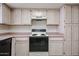 The galley kitchen features lots of storage, and a smooth cooktop range at 3833 W Rene Dr, Chandler, AZ 85226
