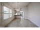 Bright eat-in kitchen with tile floors and a charming light fixture at 3833 W Rene Dr, Chandler, AZ 85226
