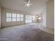 Sunlit living room with large windows and an open floor plan at 3833 W Rene Dr, Chandler, AZ 85226