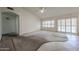 Spacious living room featuring large windows and access to the outdoors at 3833 W Rene Dr, Chandler, AZ 85226