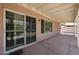 Covered patio showcasing sliding glass doors, windows and providing an inviting outdoor space at 3833 W Rene Dr, Chandler, AZ 85226