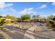 Beautiful backyard with desert landscaping, stone accents, and a cozy outdoor seating area at 4111 N Starry Pass Cir, Mesa, AZ 85207