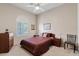 Comfortable bedroom with neutral walls, plantation shutters, and cozy decor at 4111 N Starry Pass Cir, Mesa, AZ 85207
