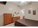 Bedroom with neutral paint, tiled floors, and a dresser with wood drawers at 4111 N Starry Pass Cir, Mesa, AZ 85207