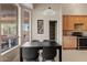 Bright dining area with table, chairs, and natural light from the kitchen at 4111 N Starry Pass Cir, Mesa, AZ 85207