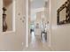 Hallway showcasing neutral paint, arched openings, tiled floors, and art pieces displayed along the walls at 4111 N Starry Pass Cir, Mesa, AZ 85207