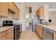 Functional kitchen with stainless steel appliances and ample counter space at 4111 N Starry Pass Cir, Mesa, AZ 85207