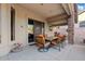 Covered patio with stone columns, and dining table for outdoor dining or entertaining at 4111 N Starry Pass Cir, Mesa, AZ 85207