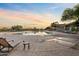 Beautiful community pool with lounge chairs and shaded seating area near open water at 4111 N Starry Pass Cir, Mesa, AZ 85207