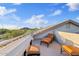 Roof deck featuring lounge chairs and views of the surrounding landscape at 4111 N Starry Pass Cir, Mesa, AZ 85207