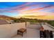 Rooftop deck with seating, mountain views, and beautiful Arizona sunset at 4111 N Starry Pass Cir, Mesa, AZ 85207
