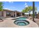 Inviting backyard pool and spa featuring desert landscaping and lounge area in a beautiful outdoor setting at 41908 N Harbour Town Ct, Anthem, AZ 85086