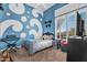 Bedroom features a blue wall with white circles, carpet, a bed, and window with blinds at 41908 N Harbour Town Ct, Anthem, AZ 85086