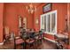 Formal dining room with wood floors, updated lighting and a large window with plantation shutters at 41908 N Harbour Town Ct, Anthem, AZ 85086