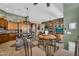 Spacious kitchen with a center island, granite counters, stone accents and stainless steel appliances at 41908 N Harbour Town Ct, Anthem, AZ 85086