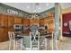 Gourmet kitchen boasts custom cabinetry, granite countertops, stainless steel appliances and travertine tile flooring at 41908 N Harbour Town Ct, Anthem, AZ 85086